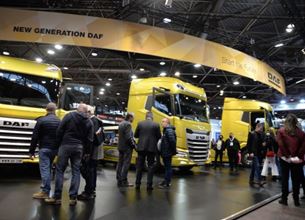 Photo of the SOLUTRANS show with yellow trucks